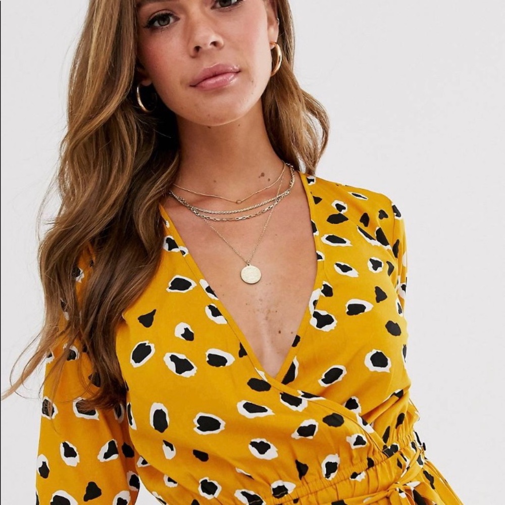 Wrap front mini dress in splonge print.